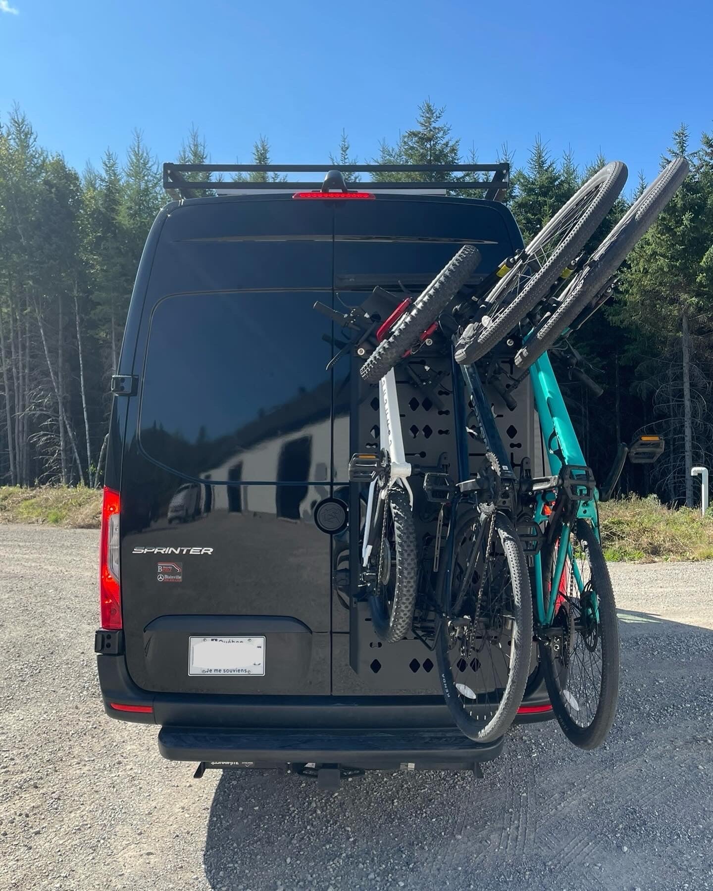 Phlosystem bicycle transport kit with three bicycles mounted on a Mercedez-Benz Sprinter