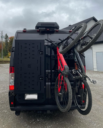 Phlosystem bicycle transport kit with two bicycles mounted on a Ford Transit.