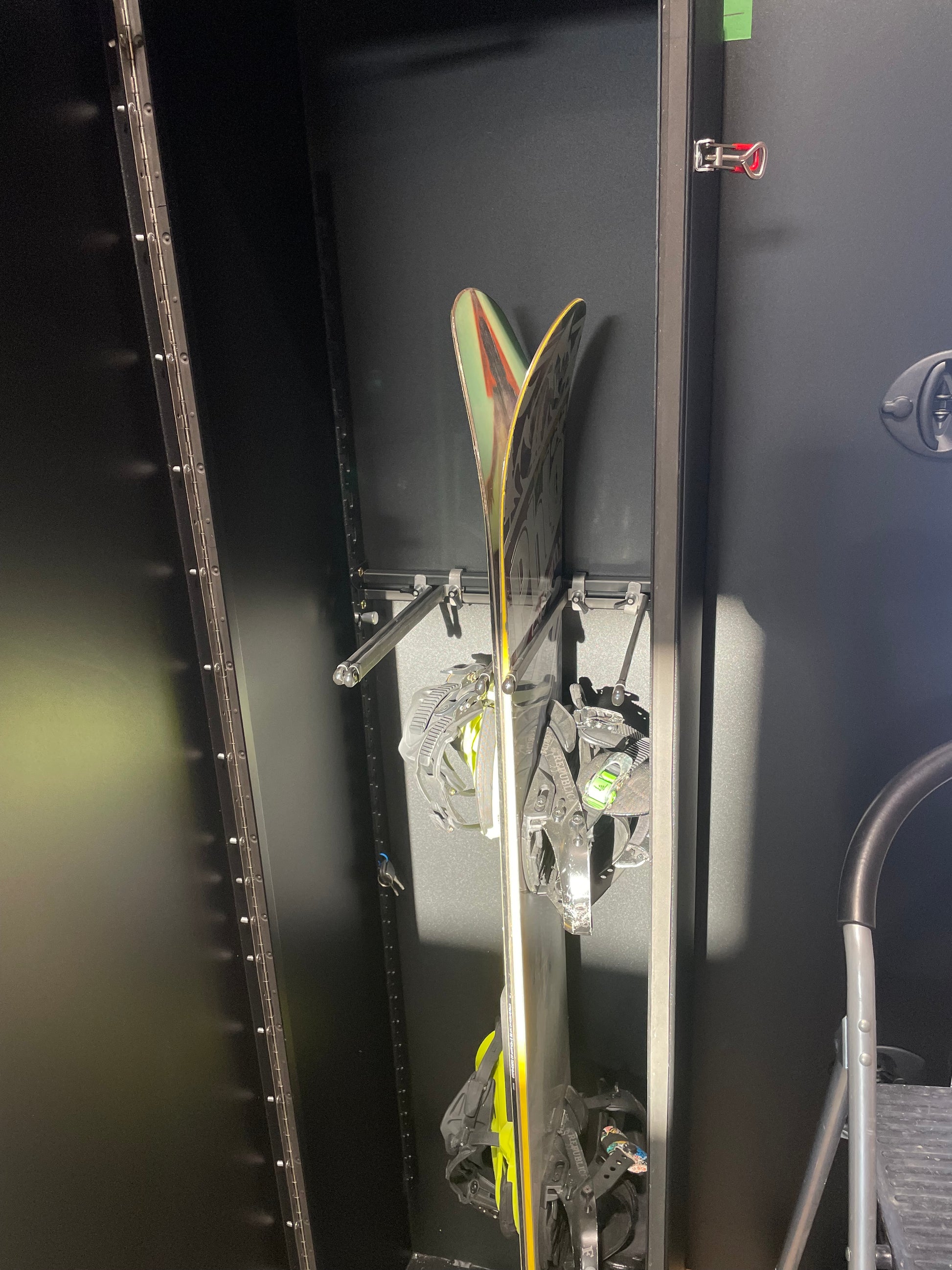 Phlosystem snowboard transport rack showing two secured snowboards.