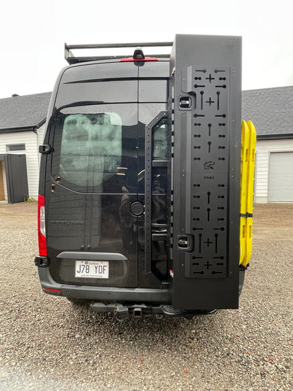 phlosytem ski storage chest installed on the right rear door of a mercedes benz sprinter
