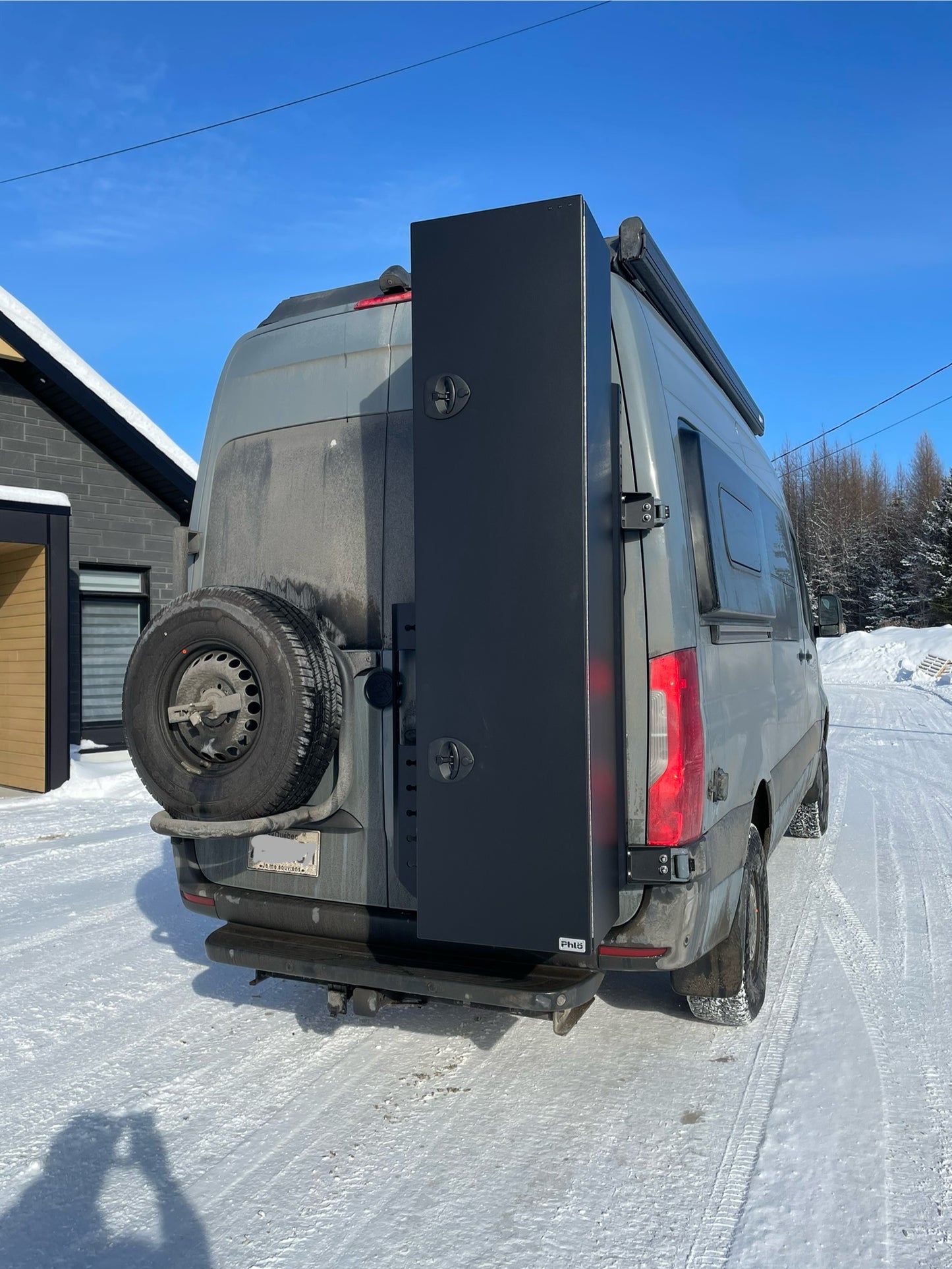 phlosytem ski storage chest installed on the right rear door of mercedes benz sprinter