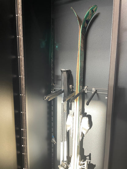 Phlosystem ski transport rack showing skis and poles secured for transport